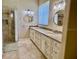 Elegant bathroom with granite countertop vanity and dual sinks at 3083 Pinnacle Ct, Clermont, FL 34711