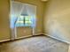 Inviting bedroom featuring natural light from the large window and carpet flooring at 3083 Pinnacle Ct, Clermont, FL 34711