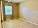 Bright bedroom with tiled floor and a large window, letting in plenty of light at 3083 Pinnacle Ct, Clermont, FL 34711