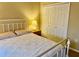 Comfortable bedroom featuring a bed with white linens and a window at 3083 Pinnacle Ct, Clermont, FL 34711