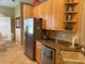 Bright kitchen with stainless steel refrigerator and plenty of storage at 3083 Pinnacle Ct, Clermont, FL 34711