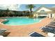 Community pool with lounge chairs and a tropical feel, perfect for relaxing by the water at 3083 Pinnacle Ct, Clermont, FL 34711