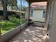 The home's screened lanai provides views of the backyard and surrounding greenery at 3083 Pinnacle Ct, Clermont, FL 34711