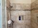 Shower featuring tiled walls, a built-in niche, and modern shower head at 3083 Pinnacle Ct, Clermont, FL 34711