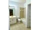 Bathroom featuring a vanity, toilet, tub/shower, and linen storage for all your needs at 3107 Sun Lake Ct # A, Kissimmee, FL 34747