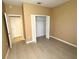 Bedroom showcasing a large closet, neutral walls, and tile floors at 3107 Sun Lake Ct # A, Kissimmee, FL 34747