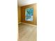 Cozy bedroom featuring a large window that offers natural light and tile flooring at 3107 Sun Lake Ct # A, Kissimmee, FL 34747