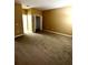 Spacious bedroom features neutral walls and carpet, closet with folding doors, ready for personalization at 3107 Sun Lake Ct # A, Kissimmee, FL 34747