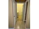 Hallway view leading to a laundry area with a white washer and dryer at 3107 Sun Lake Ct # A, Kissimmee, FL 34747
