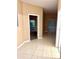 Open-concept living area with tile flooring, and multiple entryways creating an inviting space at 3107 Sun Lake Ct # A, Kissimmee, FL 34747
