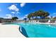 Refreshing swimming pool area with clear blue water and lounge chairs for relaxation at 3107 Sun Lake Ct # A, Kissimmee, FL 34747