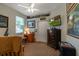Cozy bedroom with carpet flooring, ceiling fan, a work desk and decor on display at 3141 Brighton Rd, Eustis, FL 32726