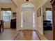 Bright foyer with tile flooring, neutral walls, and a view into adjacent rooms at 3141 Brighton Rd, Eustis, FL 32726