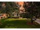 Charming single-story home with a well-maintained lawn, mature trees, and manicured landscaping at 3141 Brighton Rd, Eustis, FL 32726