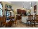 A kitchen with stainless steel appliances, granite counters, dark wood cabinets, and tile flooring at 3141 Brighton Rd, Eustis, FL 32726