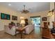 Spacious living room with neutral tones, tile floors, and a view of the outdoor patio at 3141 Brighton Rd, Eustis, FL 32726