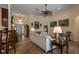 Open living room with tile floors, a ceiling fan, and multiple art pieces on the walls at 3141 Brighton Rd, Eustis, FL 32726
