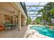 Entertain in style with a screened-in pool, outdoor dining area, and lush landscaping surrounding the backyard at 3141 Brighton Rd, Eustis, FL 32726