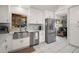 Modern kitchen with stainless steel appliances, white cabinetry and countertops, and a stainless steel sink at 33637 E Lake Joanna Dr, Eustis, FL 32736