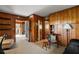 Cozy interior room featuring wood paneling, tile floors, with access to other living spaces at 33637 E Lake Joanna Dr, Eustis, FL 32736