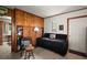 Casual interior living space featuring wood paneling, and a view into another room at 33637 E Lake Joanna Dr, Eustis, FL 32736