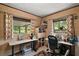 Bright home office with dual workstations, natural light, and ample storage at 33637 E Lake Joanna Dr, Eustis, FL 32736