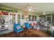 Charming sunroom featuring comfortable seating and a ceiling fan for year-round enjoyment at 33637 E Lake Joanna Dr, Eustis, FL 32736
