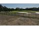 View of the golf course behind the wrought iron fence in the backyard at 33818 Venice Ln, Sorrento, FL 32776