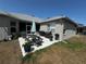 Outdoor patio with picnic table, grill, and view of the backyard at 33818 Venice Ln, Sorrento, FL 32776