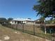 Spacious fenced-in backyard with green grass, perfect for outdoor activities and relaxation at 33818 Venice Ln, Sorrento, FL 32776
