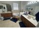 Spacious main bathroom with dual sinks, a soaking tub, and a walk-in shower at 33818 Venice Ln, Sorrento, FL 32776