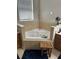 Corner soaking tub with tile surround in the main bathroom with a stool at 33818 Venice Ln, Sorrento, FL 32776
