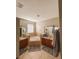 Bathroom featuring a corner bathtub with tile surround, double sinks, and dark wood cabinets at 33818 Venice Ln, Sorrento, FL 32776