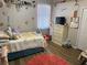Colorful bedroom with fun decor, plush rug, and window for natural light at 33818 Venice Ln, Sorrento, FL 32776