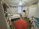 Charming bedroom featuring a ceiling fan, playful decor, and cozy atmosphere at 33818 Venice Ln, Sorrento, FL 32776