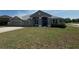 Charming home with well-maintained lawn, complemented by a two-car garage and attractive curb appeal at 33818 Venice Ln, Sorrento, FL 32776