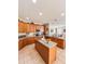 Spacious kitchen featuring granite countertops, stainless appliances, and a central island at 33818 Venice Ln, Sorrento, FL 32776