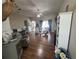 Spacious living room with wood floors, ceiling fan, furniture, and a view of the exterior at 33818 Venice Ln, Sorrento, FL 32776