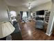 This living room features wood floors, comfortable seating, and backyard views at 33818 Venice Ln, Sorrento, FL 32776