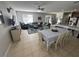 Spacious living room and dining area with tile floors and lots of natural light at 33818 Venice Ln, Sorrento, FL 32776