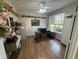 This office features wood floors, a shelf, a computer, and a window with natural light at 33818 Venice Ln, Sorrento, FL 32776