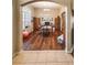 Bright office with wood laminate floors, lots of light, a wooden table, and coordinated cabinetry for storage at 33818 Venice Ln, Sorrento, FL 32776
