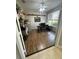 This office has wood floors, a shelf displaying toy tractors, and a window providing natural light at 33818 Venice Ln, Sorrento, FL 32776