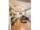 Bright office space with wood floors, a ceiling fan, and a shelf for displaying collectibles at 33818 Venice Ln, Sorrento, FL 32776