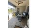 Relaxing screened-in porch with outdoor furniture and a view of the backyard at 33818 Venice Ln, Sorrento, FL 32776