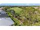 Aerial view of a home near a golf course, showcasing lush greenery and scenic views at 3393 Talley Ridge Dr, The Villages, FL 32162