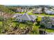 Aerial view of a property featuring a well-manicured lawn and screened lanai at 3393 Talley Ridge Dr, The Villages, FL 32162