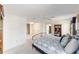 Spacious bedroom with carpet flooring, ceiling fan, and walk-in closets at 3393 Talley Ridge Dr, The Villages, FL 32162