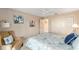 Charming bedroom with a ceiling fan, double closets, comfortable seating and a patterned comforter at 3393 Talley Ridge Dr, The Villages, FL 32162