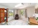 Bright room with a desk and chair with a view of the outside from the windows at 3393 Talley Ridge Dr, The Villages, FL 32162